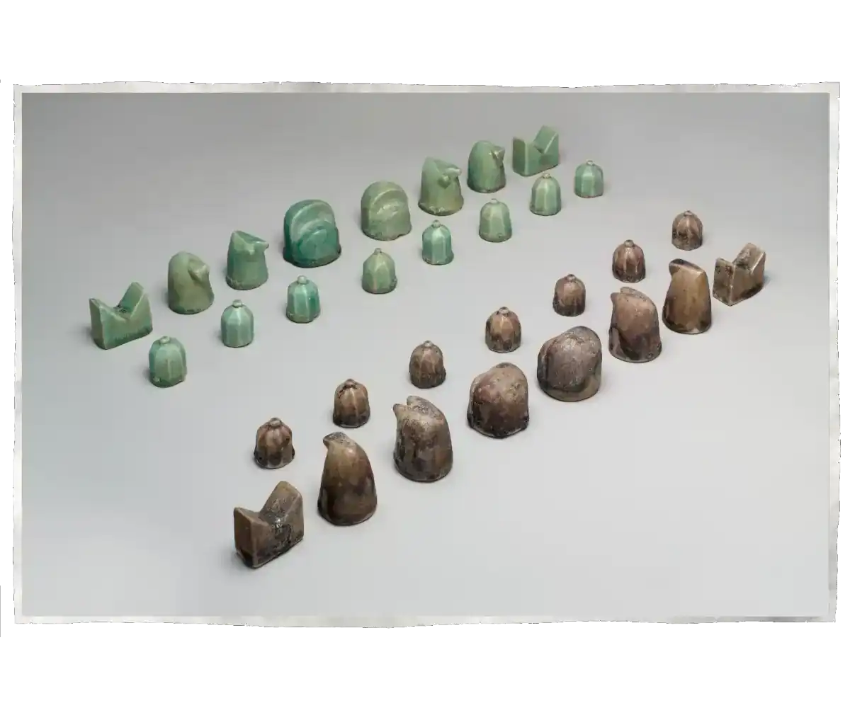 A well-preserved 12th century chess set from Nishapur in Iran showing dark and green chess pieces